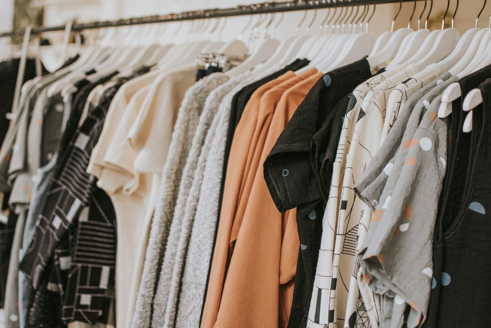 A thoughtfully arranged wardrobe in soft neutral tones